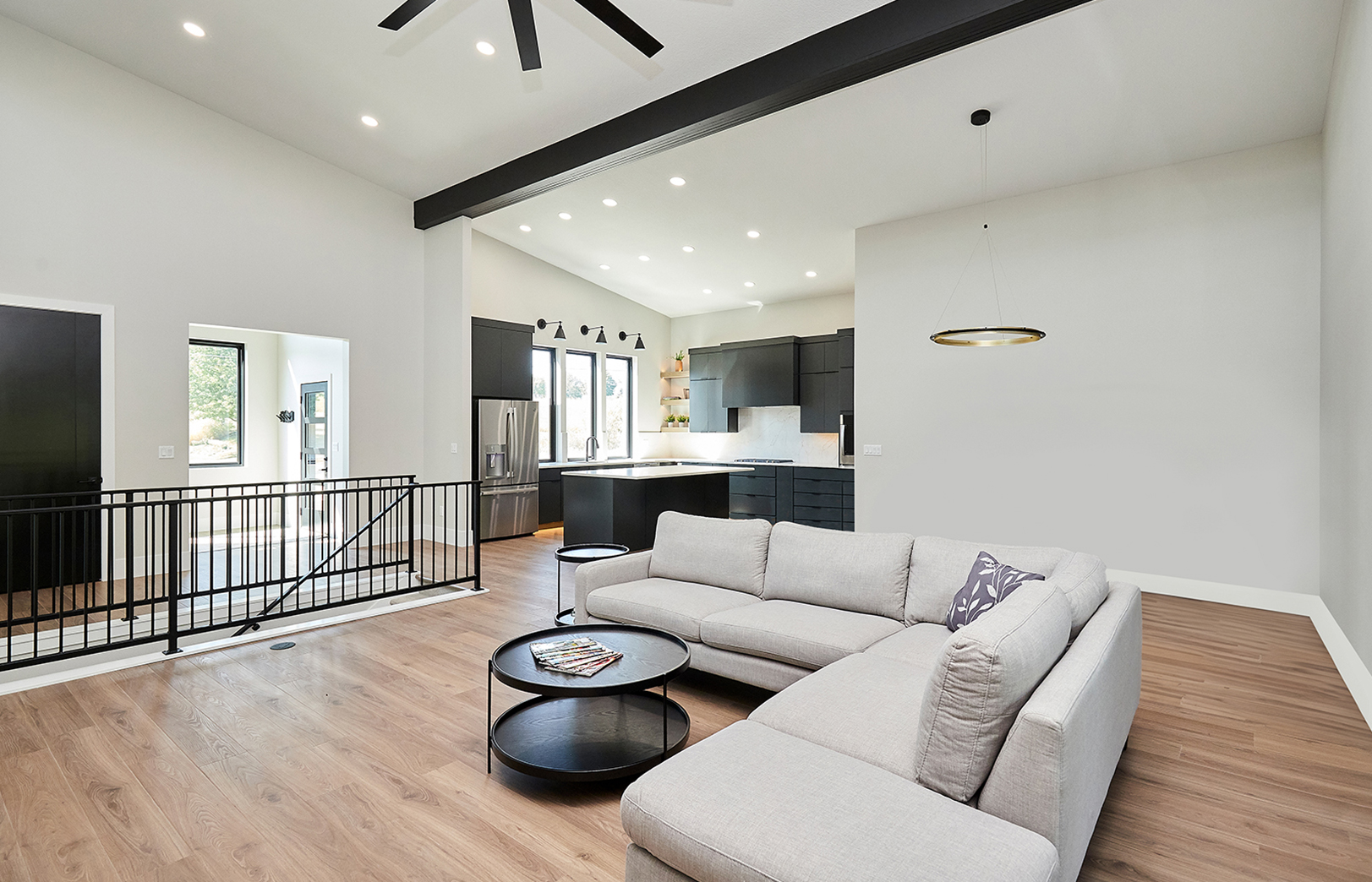 open concept living area looking at couch into kitchen