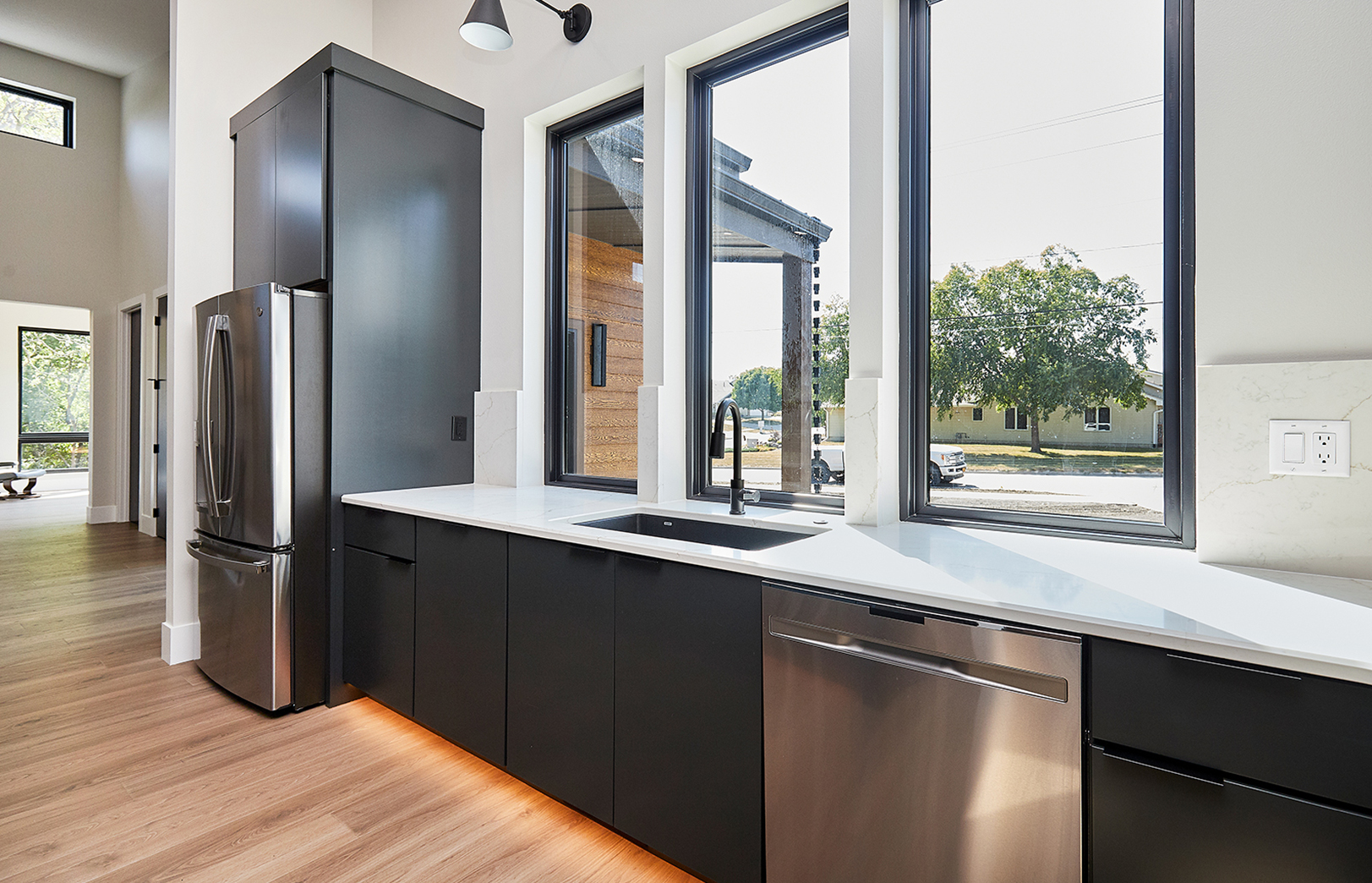 kitchen with stainless steel dishwasher and refrigerator
