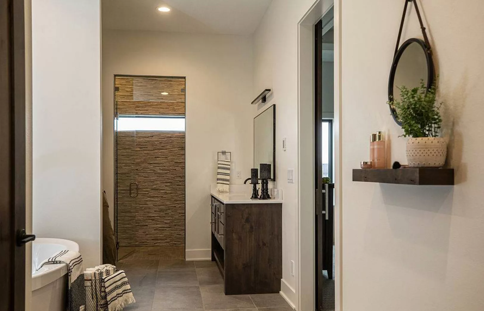 bathroom looking at walk in shower with custom tile