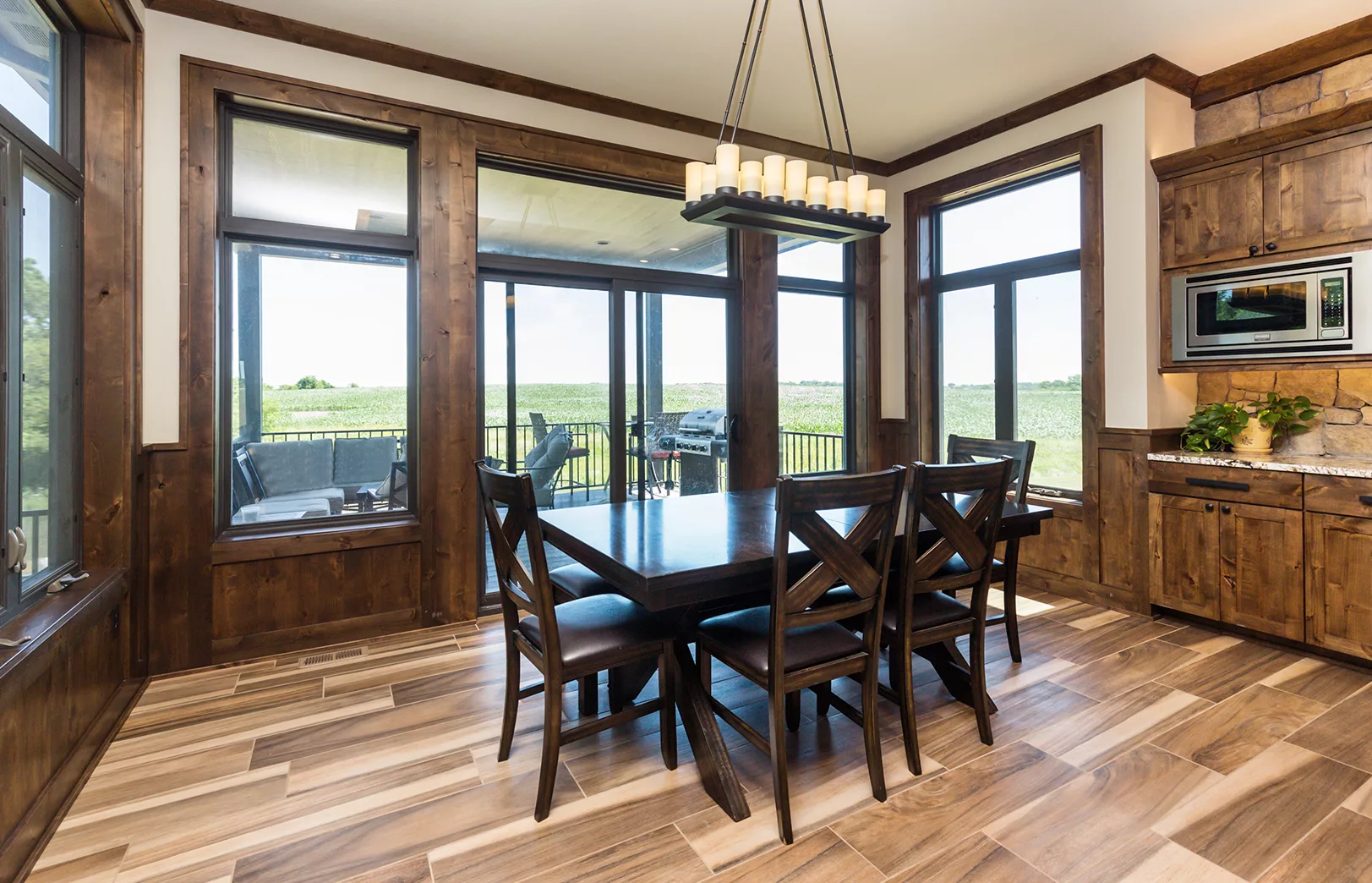 dining area with windows surrounding