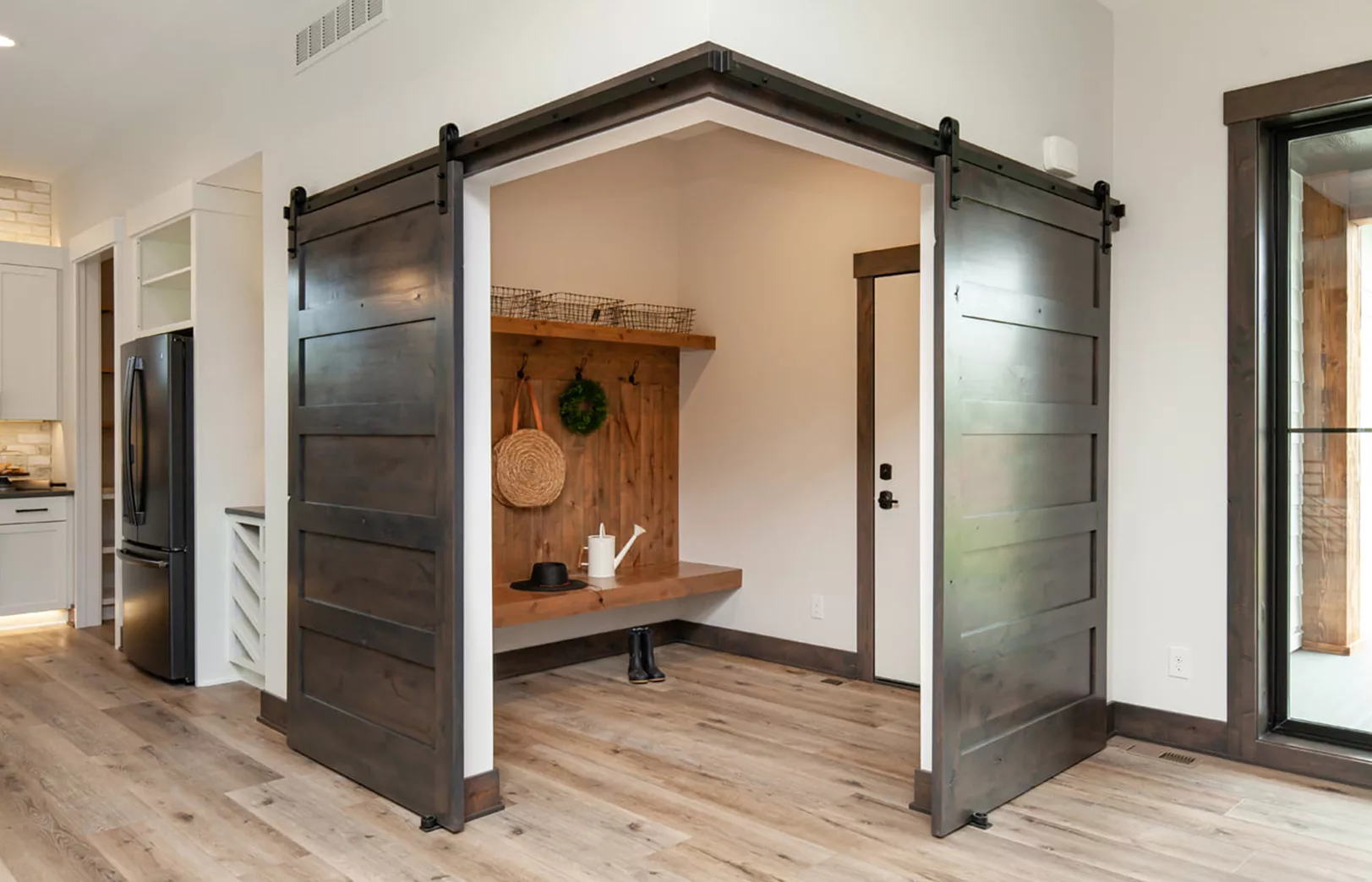 double sliding doors into mudroom